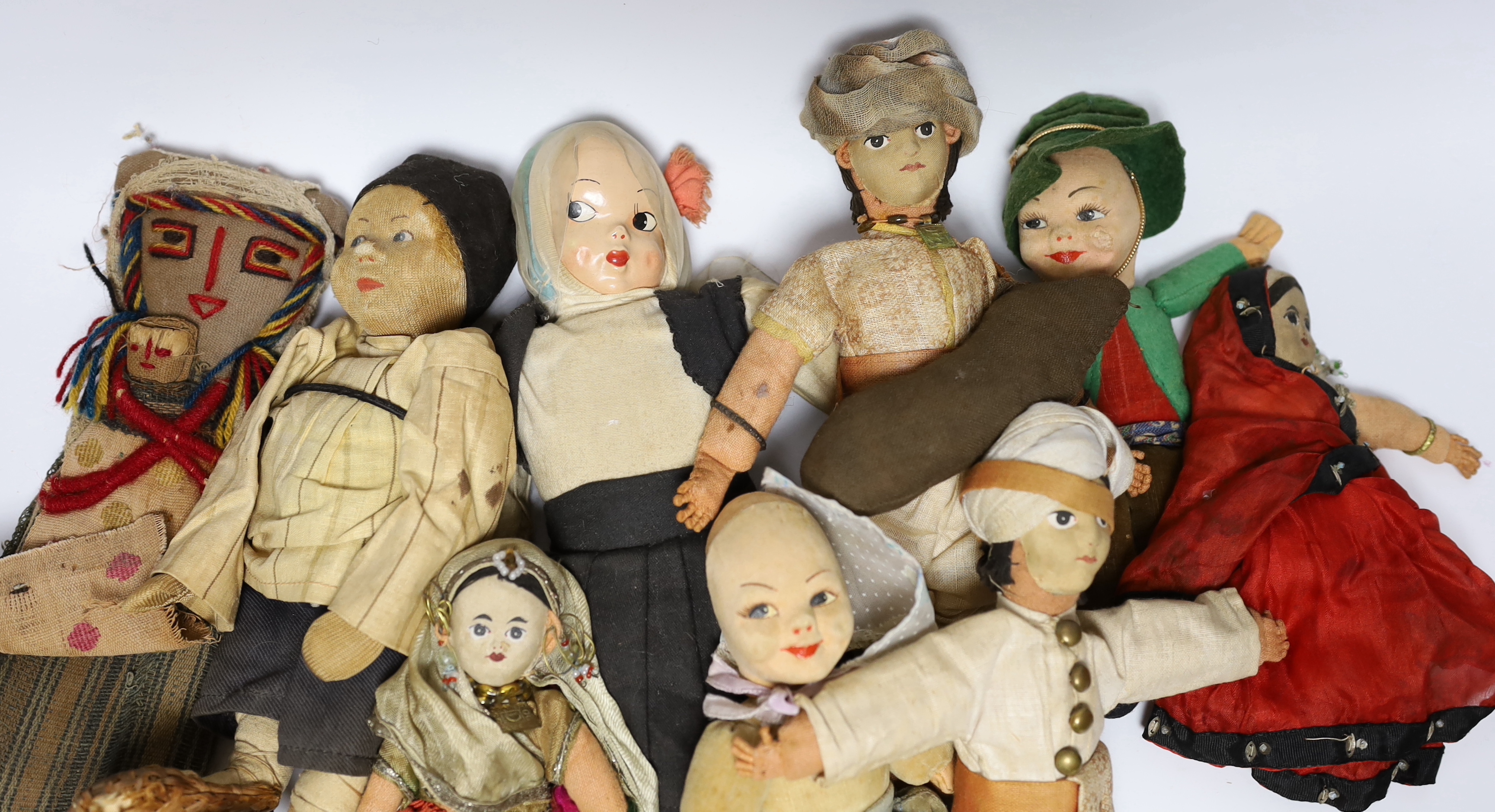 Nine dolls in European and Asian costumes